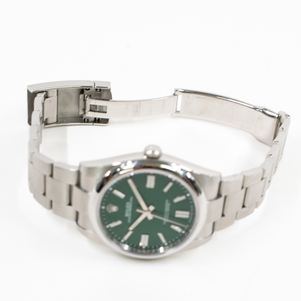 Rolex Oyster Perpetual 41 124300 Green Dial Stainless Steel Watch Box Papers