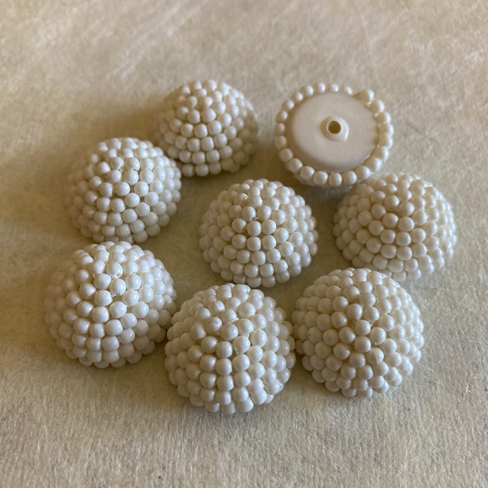 AM1186 Vintage plastic cabochons 19.5mm dia 10.2mm high off-white beaded (8)