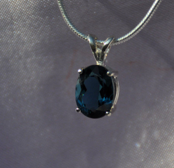 9mm X 7mm OVAL SHAPE LONDON BLUE TOPAZ PENDANT- .925 STERLING SILVER