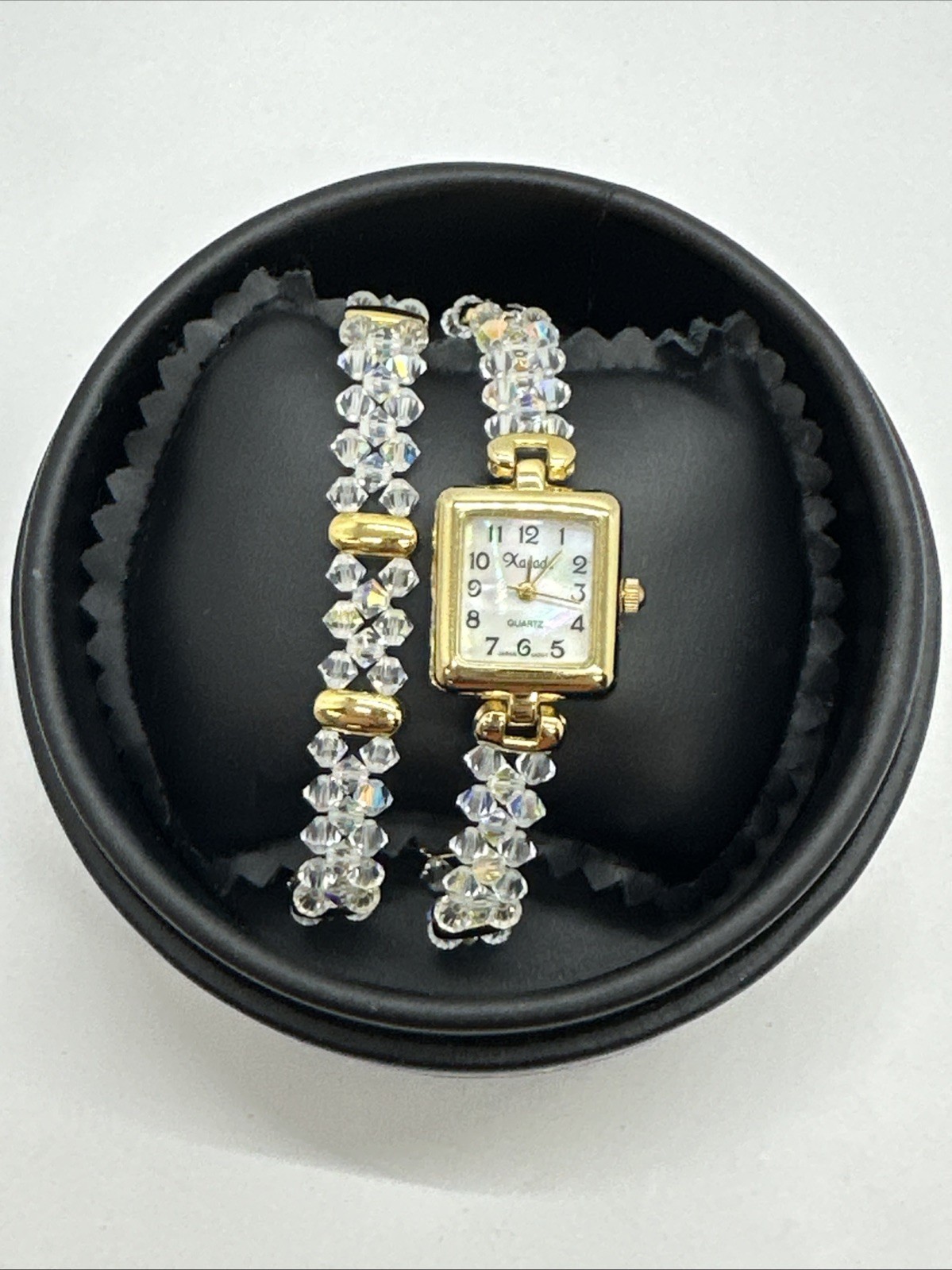 Xanadu Quartz Crystal and Gold Tone Watch AND Bracelet comes with box