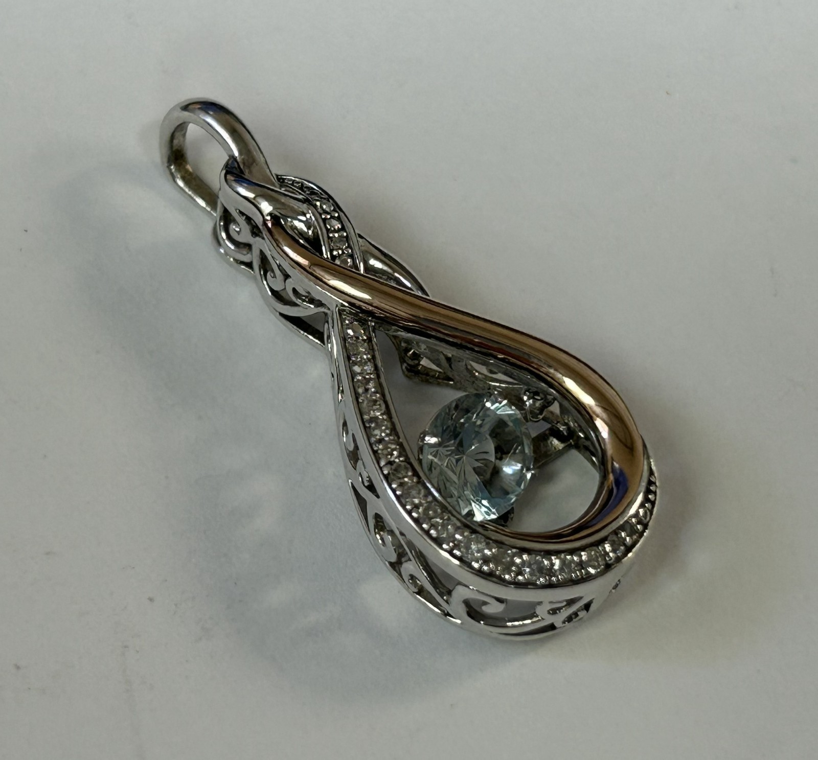 (MA6) OTC 925 / 14k “Rhythm of Love” Diamond Infinity Knot Pendant w/ Blue Topaz