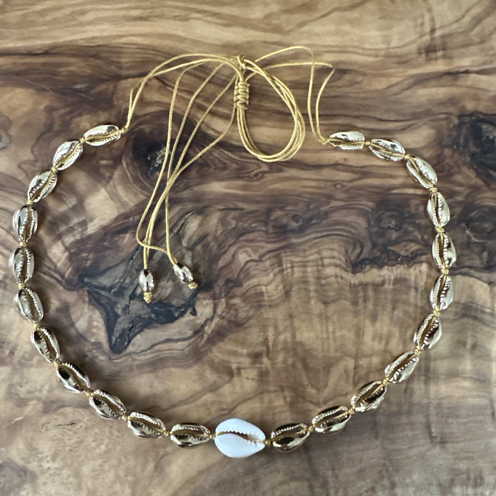 gold cowrie shell choker necklace w/ single white shell accent adjustable cord