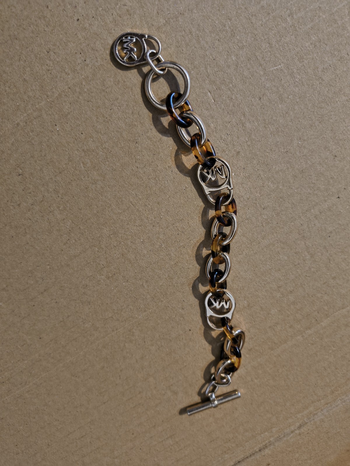 Michael Kors Silver Tone Oval Link Toggle Bracelet w/ Brown Dangle Logo Charms
