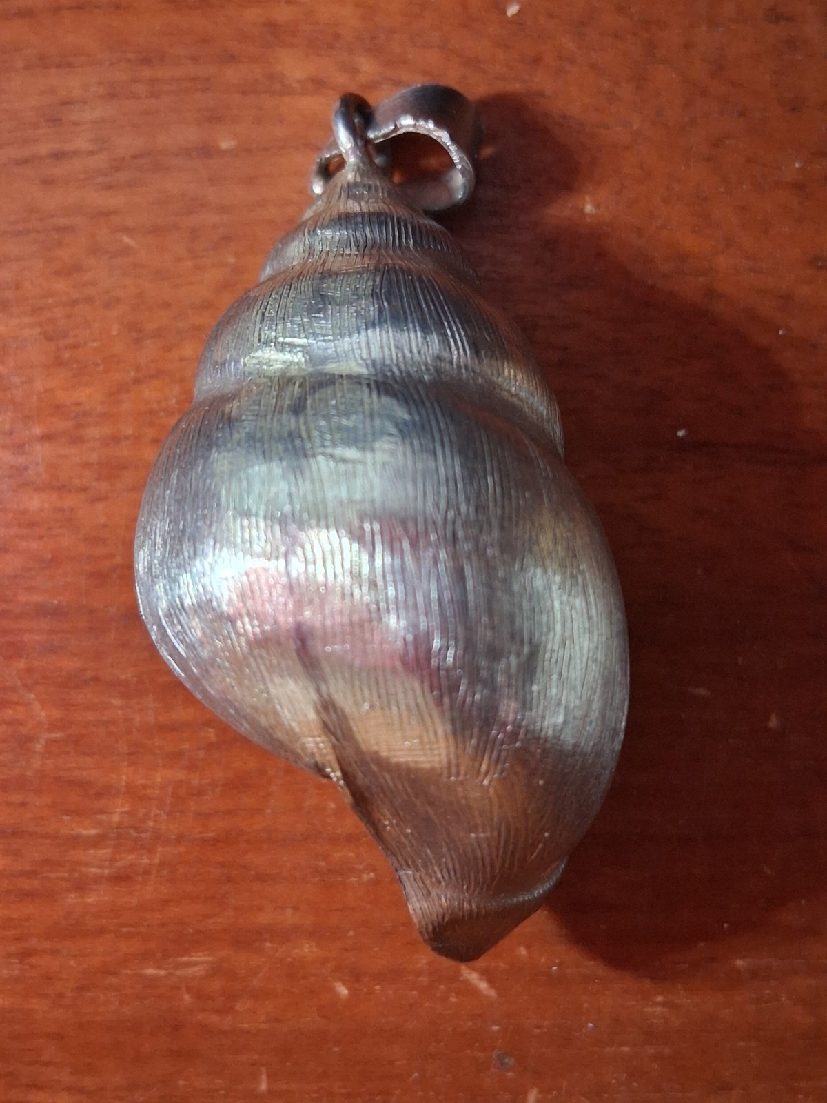 925 Silver Conch Shell Pendant weighing 16 grams 1 3/4 inches long.