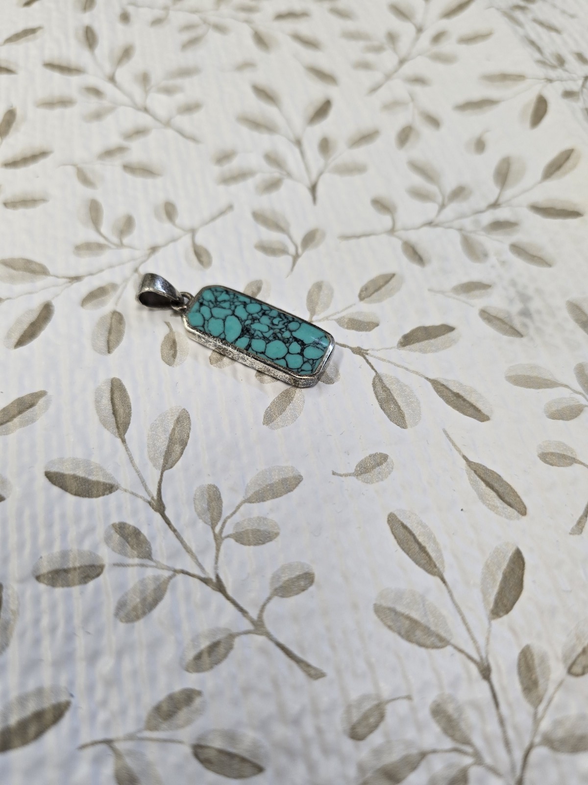 Sterling silver (925) turquoise pendant featuring a rectangular cabochon