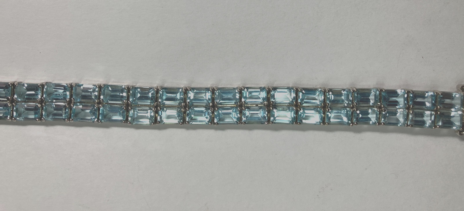8” TENNIS BRACELET -ADI 925 STERLING SILVER – 40 EMERALD CUT TOPAZ STONES -NICE!
