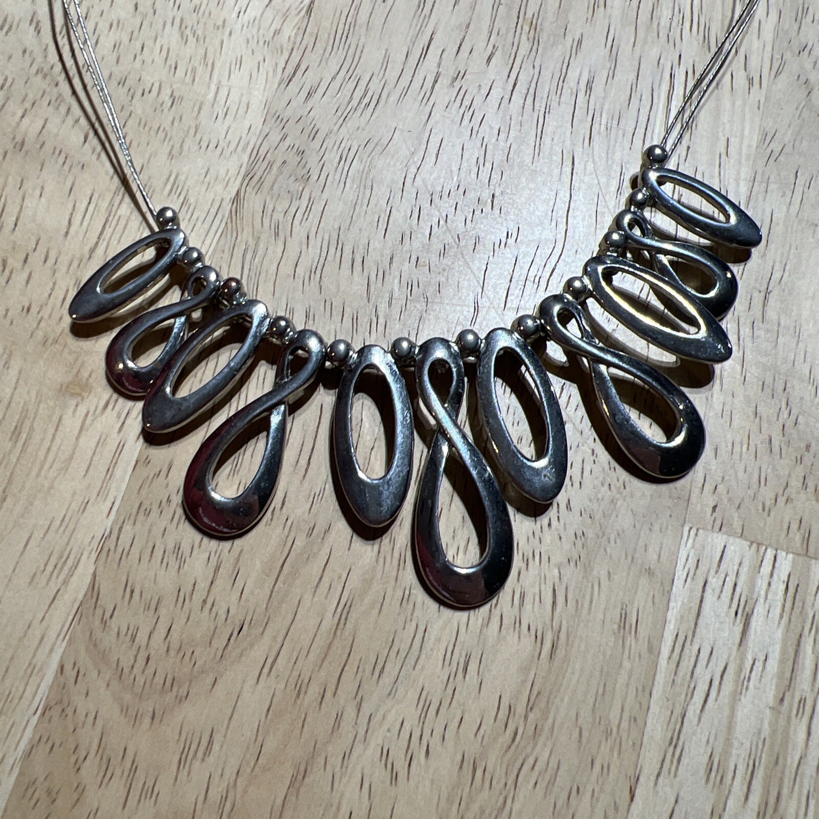 Lia Sophia Tear Drop Twist Pendant Wire Necklace Silver Tone Finish