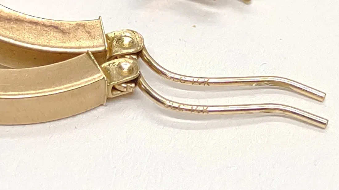 14 karat white and yellow gold hoop earrings. 25mm diameter