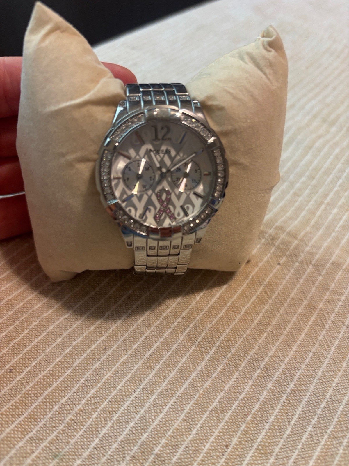GUESS-Breast cancer awareness Silver-tone stainless steel watch , needs battery