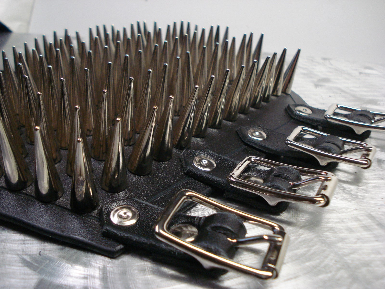 LEATHER SPIKED CONE GAUNTLET. BLACK METAL… (MDLG0231)….. BEHEXEN