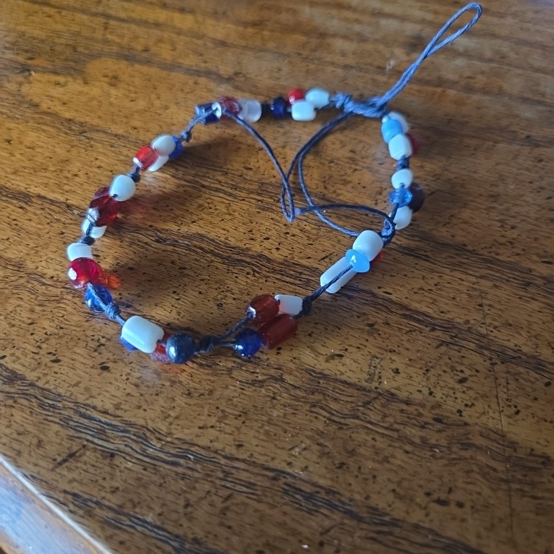 Patriotic red white & blue 7 inch bracelet. Size is adjustable Tie one