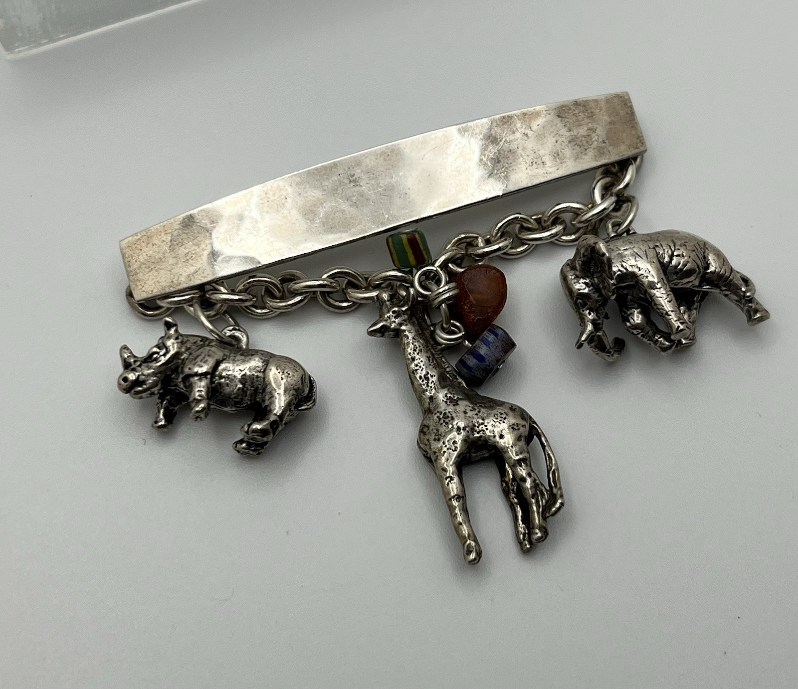 Vintage SUSAN CUMMINGs Safari Theme Sterling Silver Brooch/ Pin with charms!