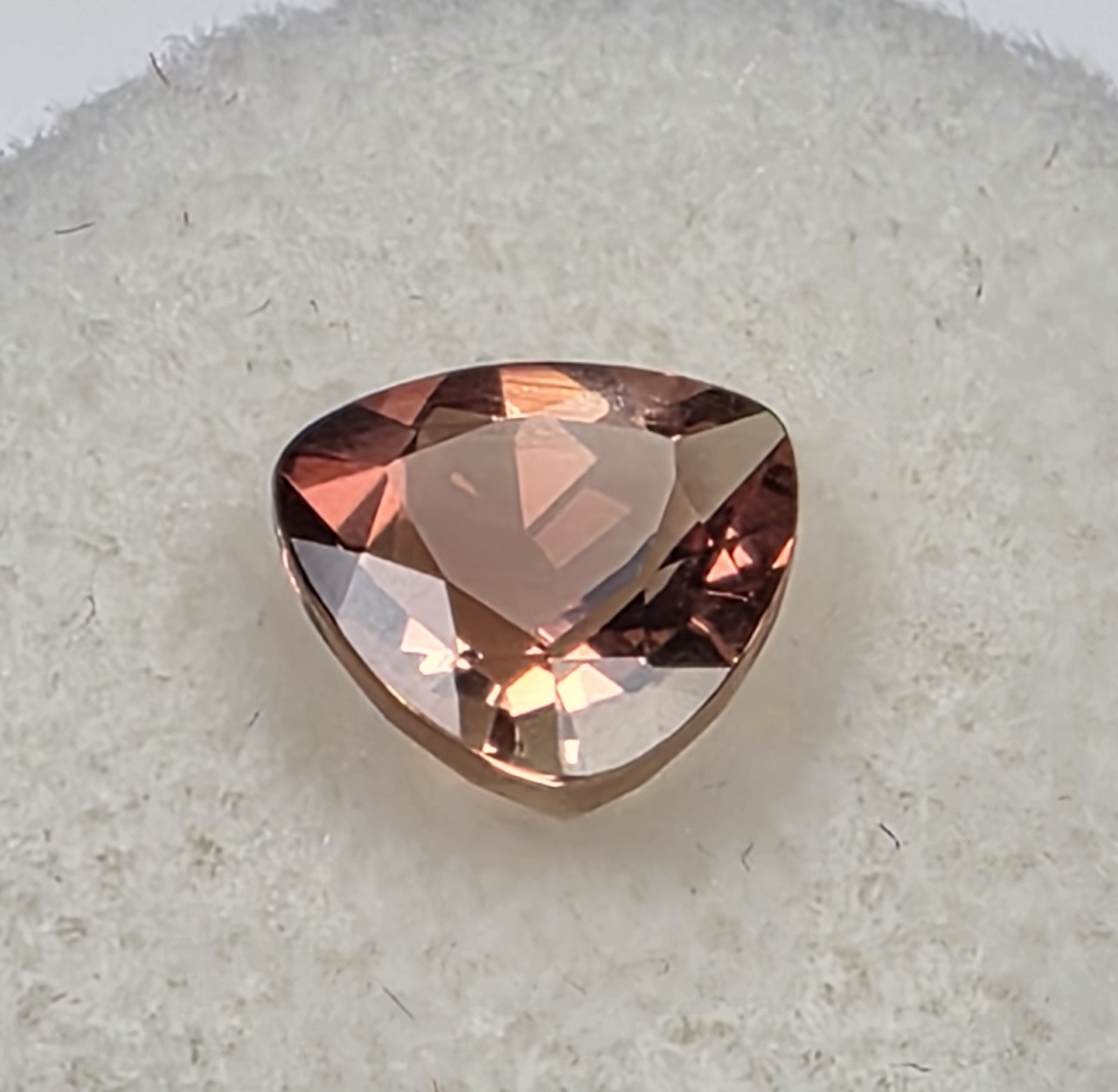 1.72 ct Oregon Sunstone –Trillion Cut – Reddish Orange Color Center Under Table