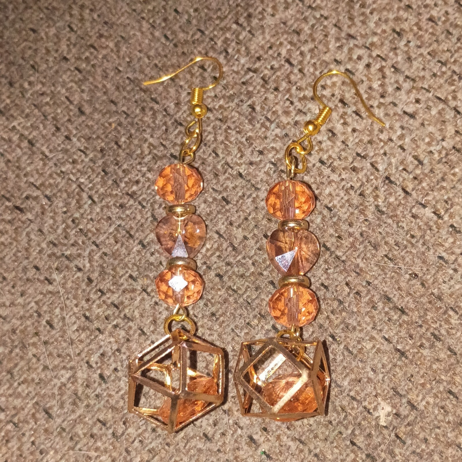 Handmade Beaded Earrings That Are Gold And Pink And Dangly