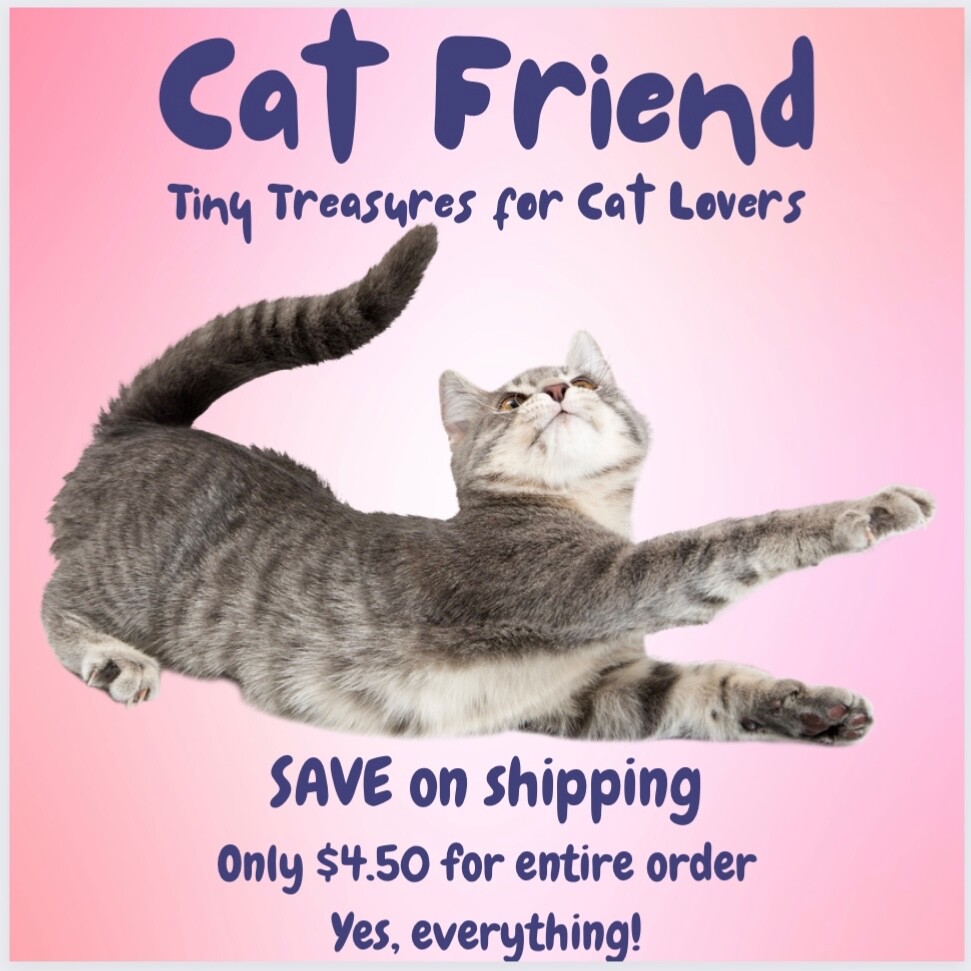 Rich red, shiny heart with comfy cat resting on top. Puffed up. Pin, brooch.