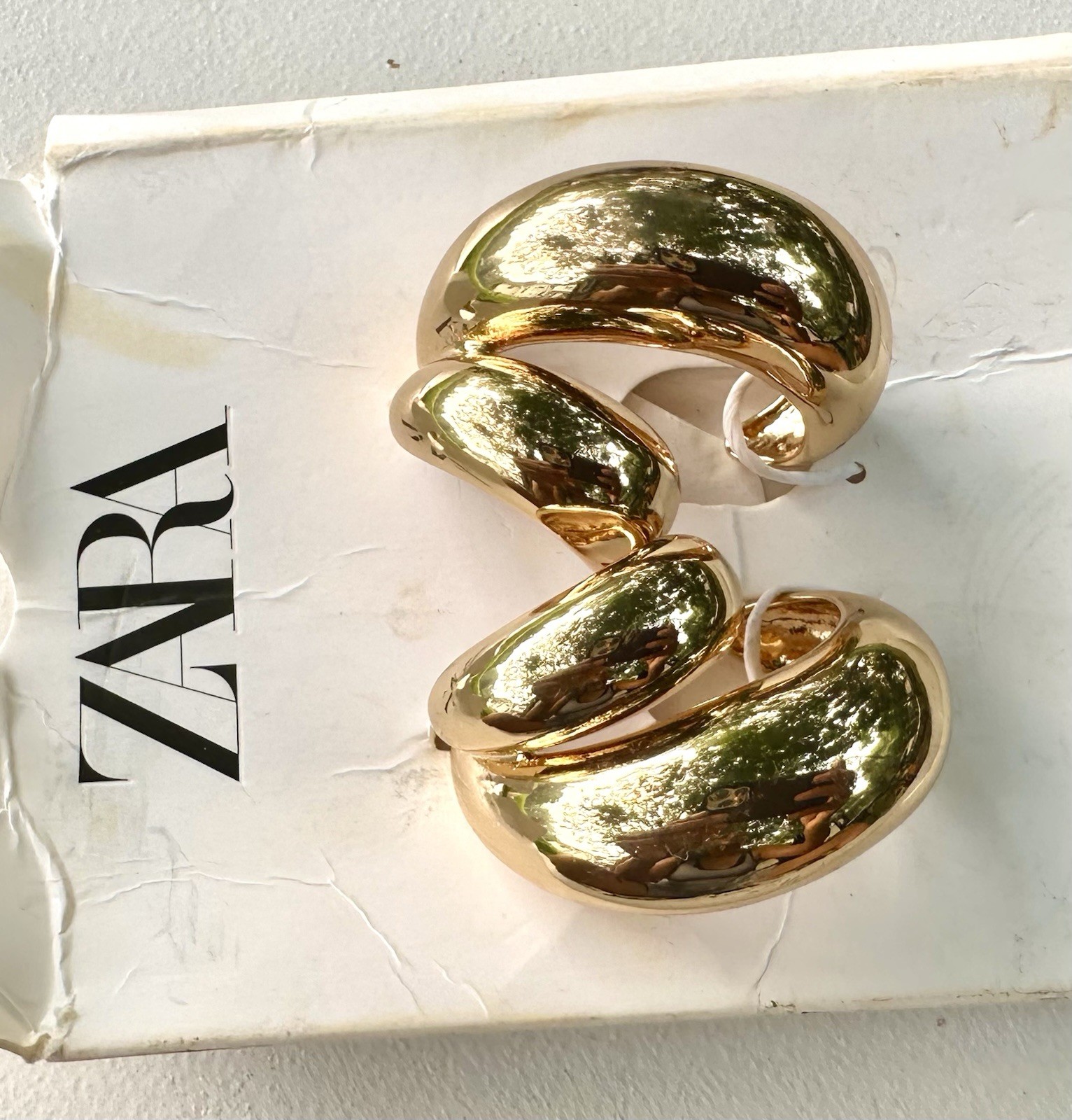 Zara Double Teardrop Earrings in gold.