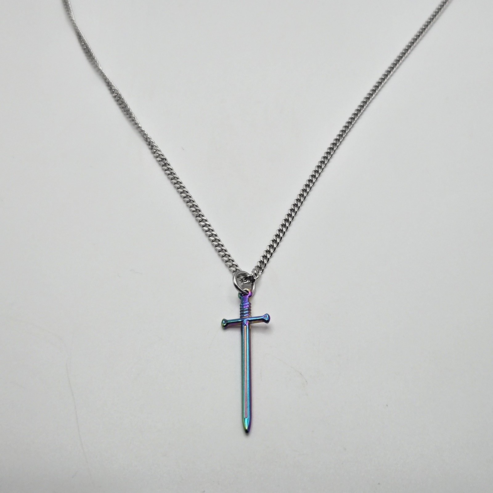 MULTI COLOR SMALL SWORD CHARM / 18″-24″ STAINLESS STEEL CURB CHAIN NECKLACE