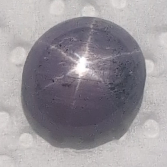 Purple Star Sapphire Found In Franklin N.C. 9.5 Carat Glows Under Blacklight.