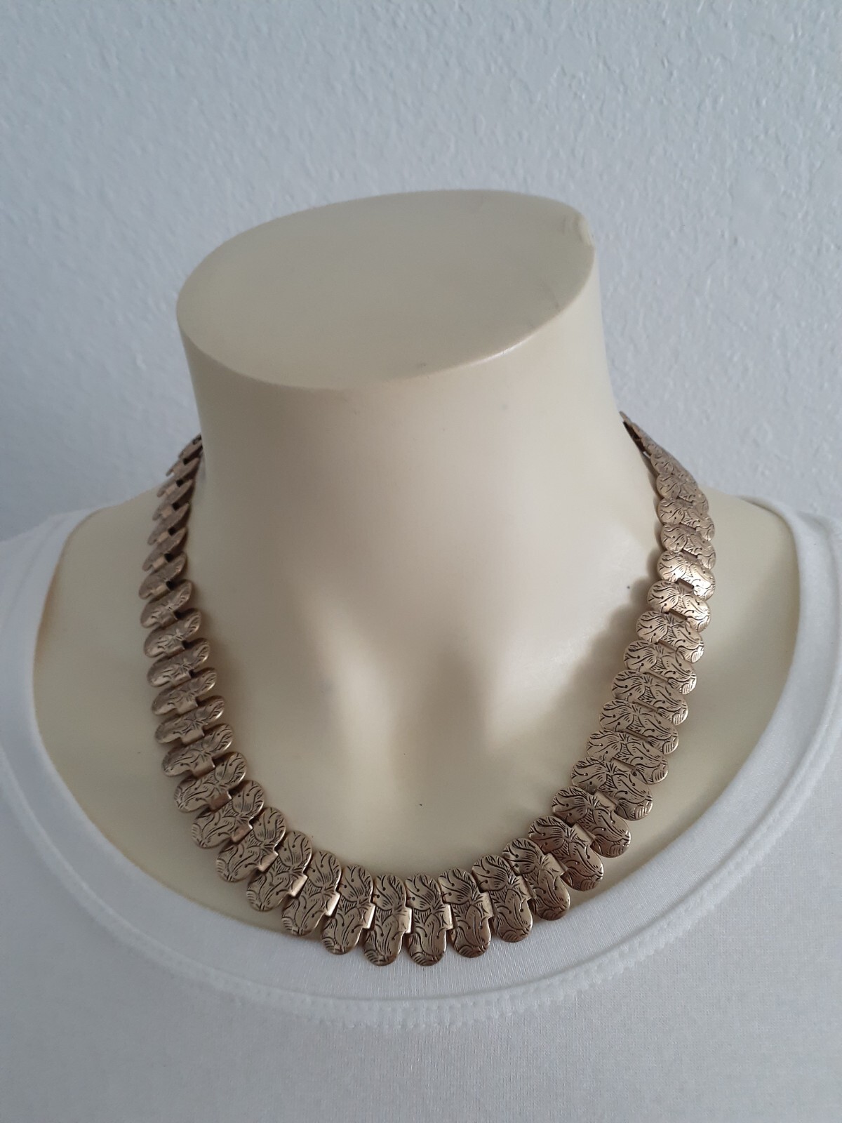 CABI two pc. necklace and bracelet set light gold/bronze with figures Beautiful.
