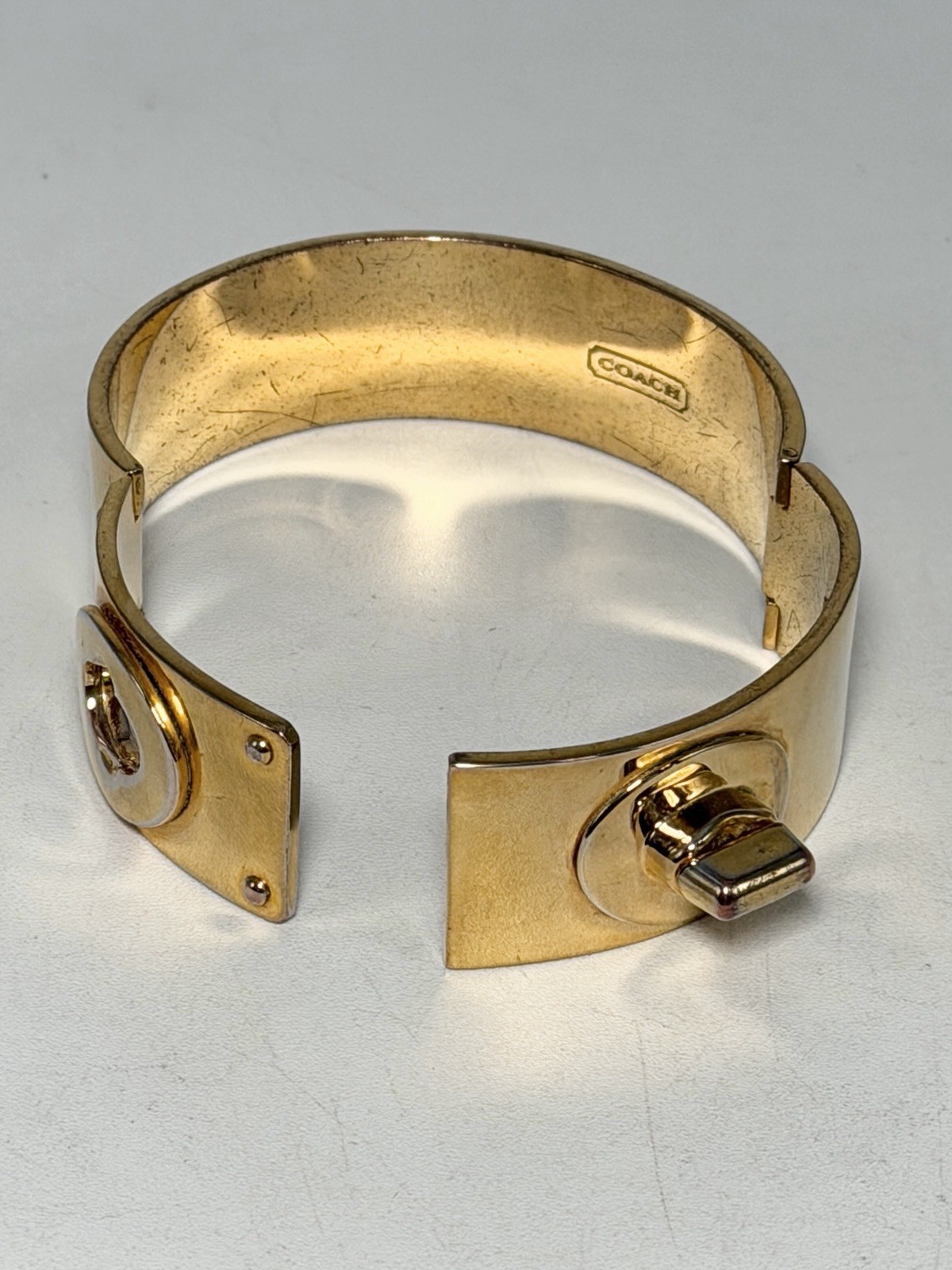 Coach Shiny Gold Turn Lock Bracelet Bangle Opens closes 3/4″ Thick