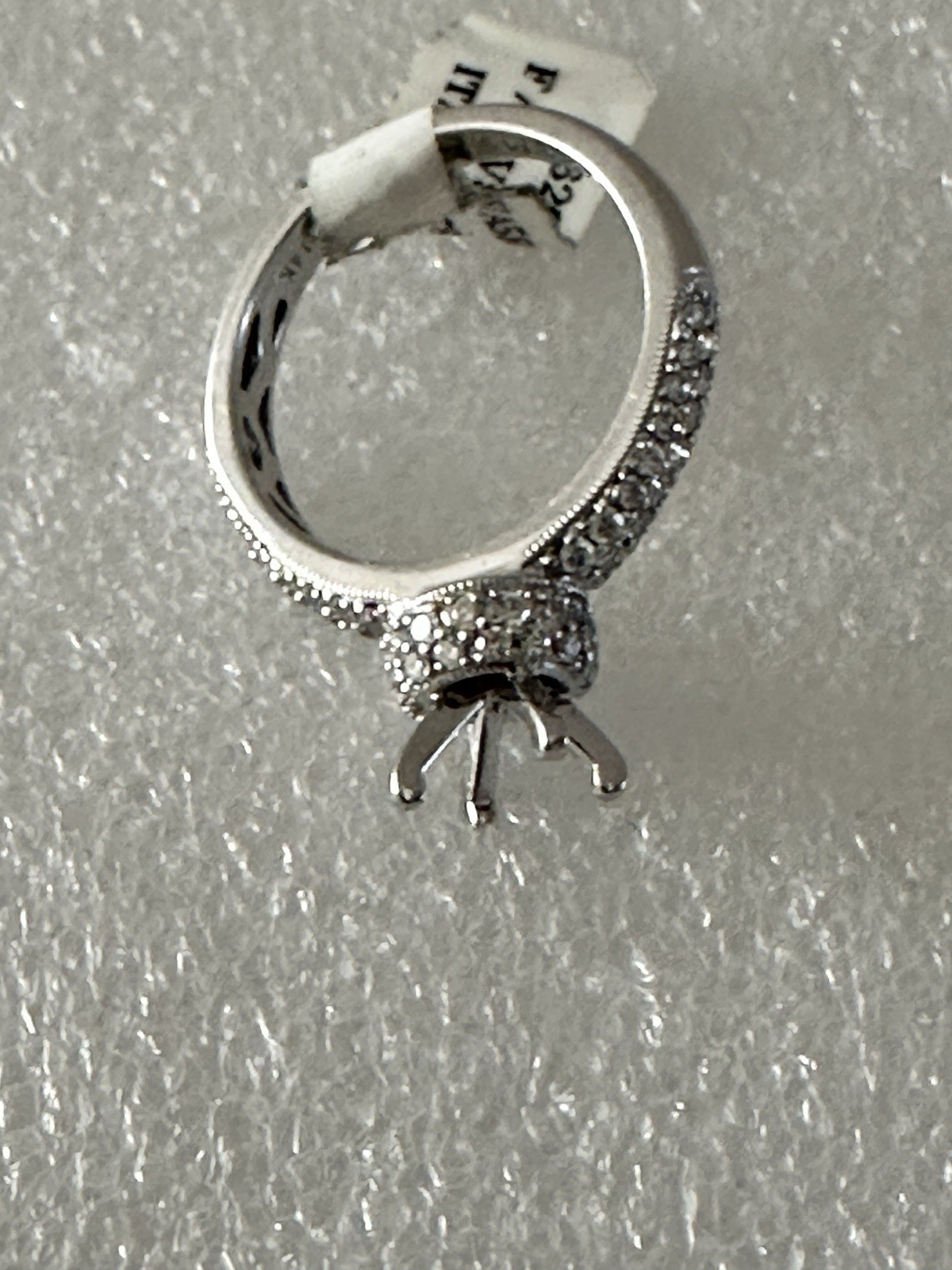 14kt,white gold semi mount ring with 0.62ct, VS2 clarity size 6, 4.40 grams.