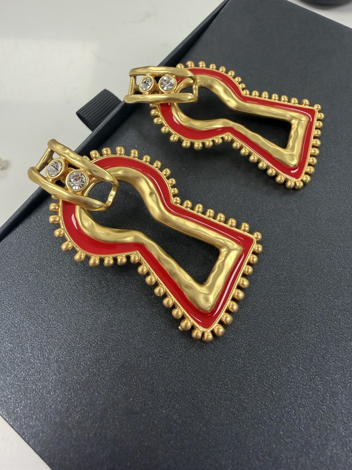 Surrealist, Schiaparelli style, keyhole stud earrings, gold with red enamel