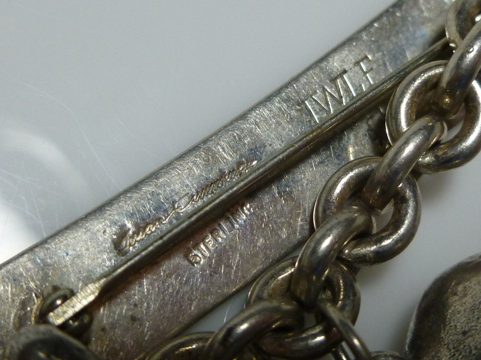 SUSAN CUMMINGS STERLING SILVER HAMMERED BAR ELEPHANT DANGLE BROOCH PIN