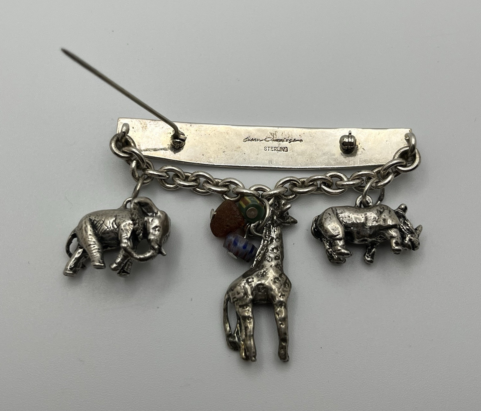 Vintage SUSAN CUMMINGs Safari Theme Sterling Silver Brooch/ Pin with charms!