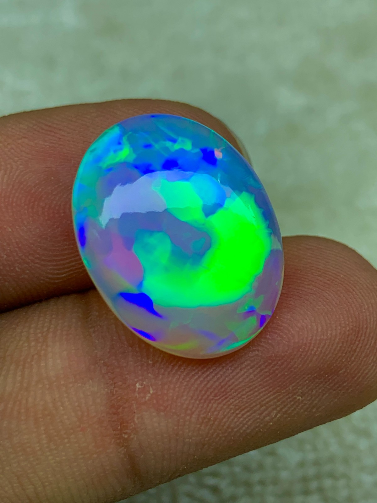 Natural Ethiopian Opal 8.30 Carat Oval Cabochon Rainbow Fire Welo Gemstone
