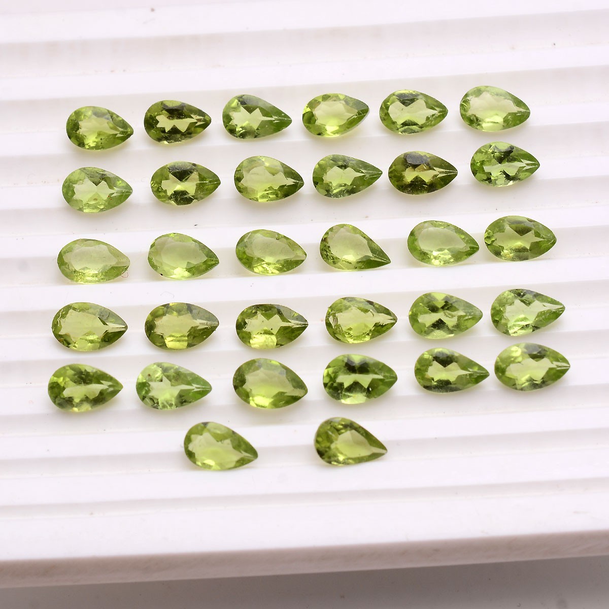 32 Pcs VVS Natural Peridot 7.74mm-8.20mm Pear Cut Stunning Untreated Gemstones