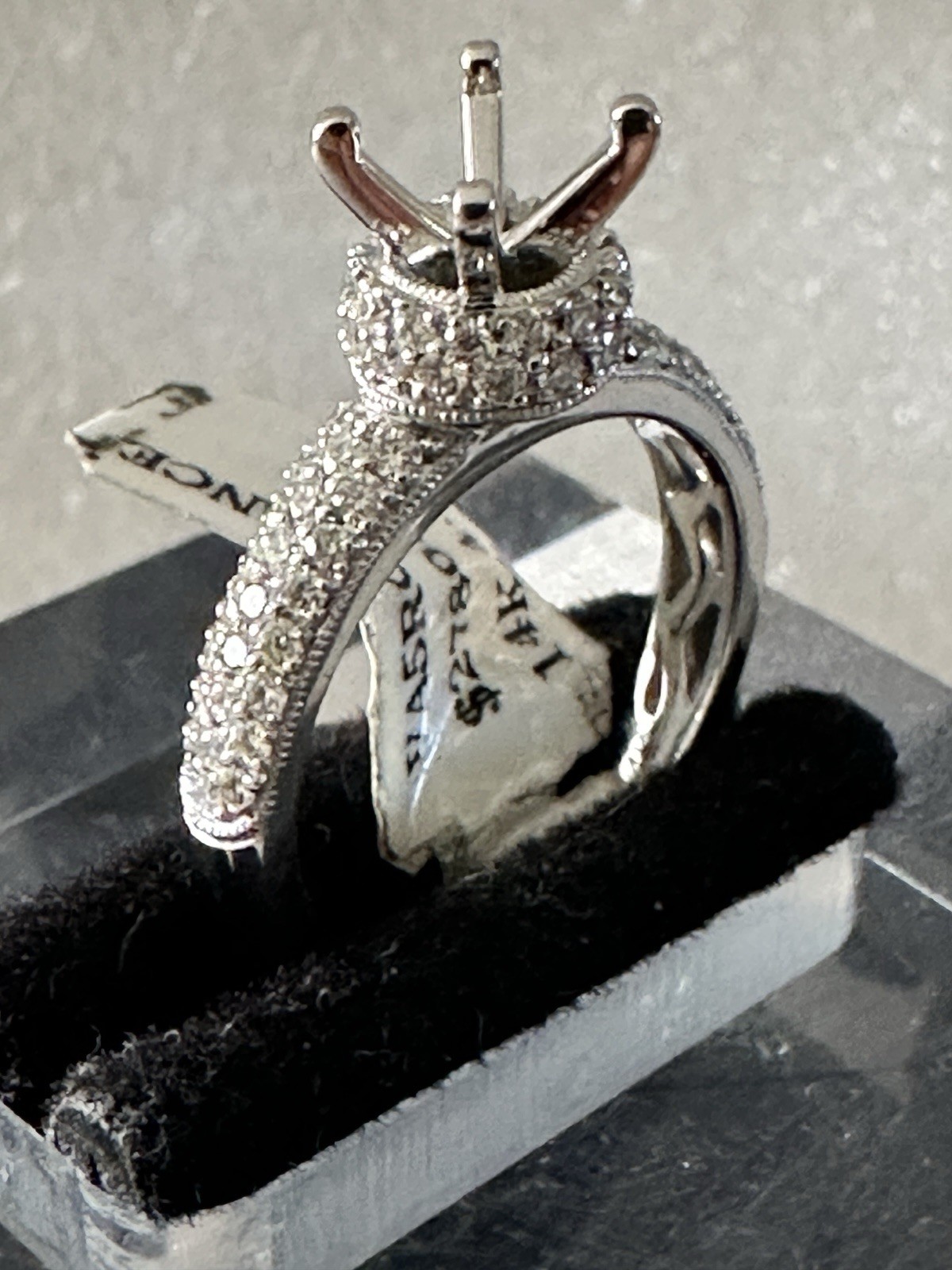 14kt,white gold semi mount ring with 0.62ct, VS2 clarity size 6, 4.40 grams.