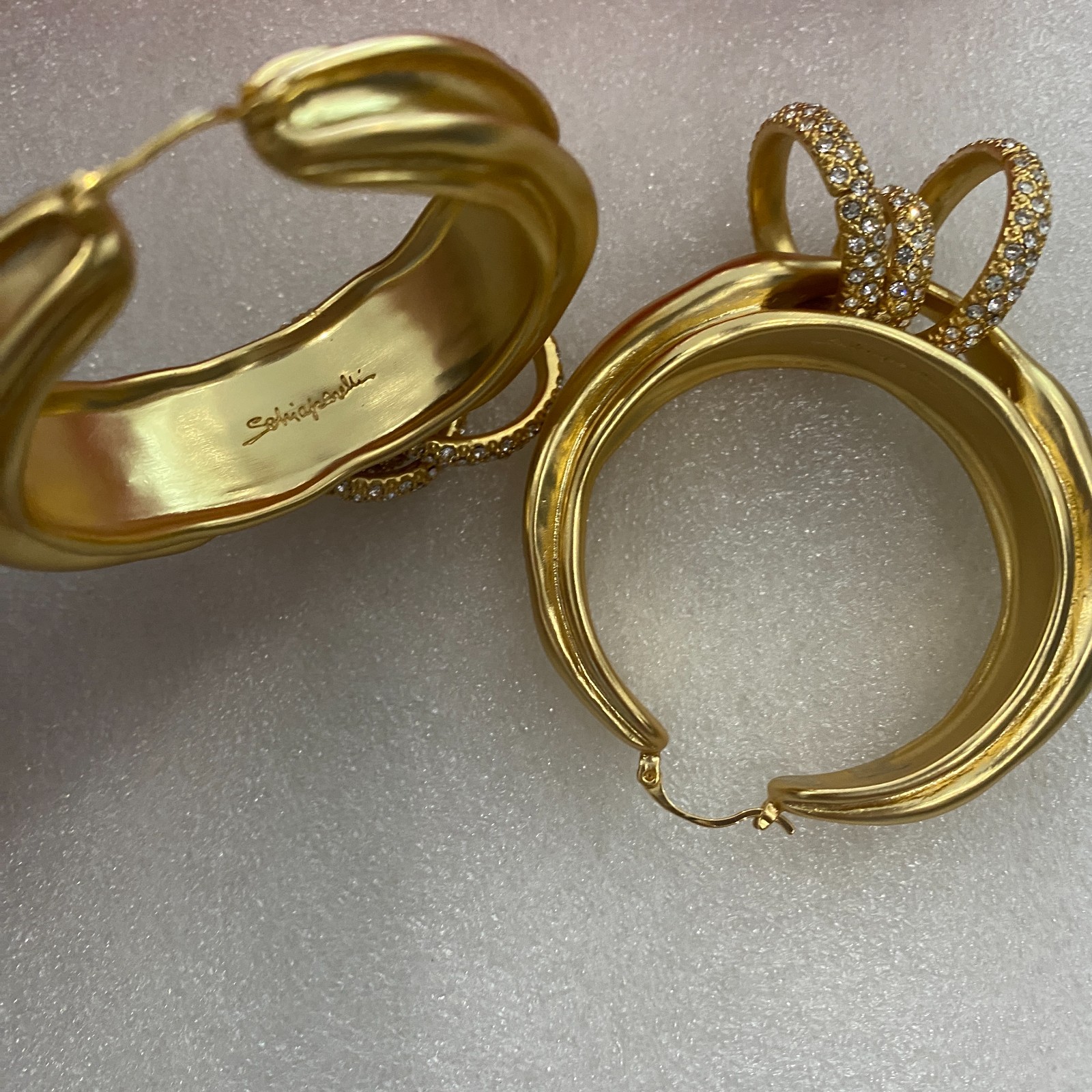 Schiaparelli Asymmetrical Twisted Gold Hoop Earrings With Pave Crystal Rings