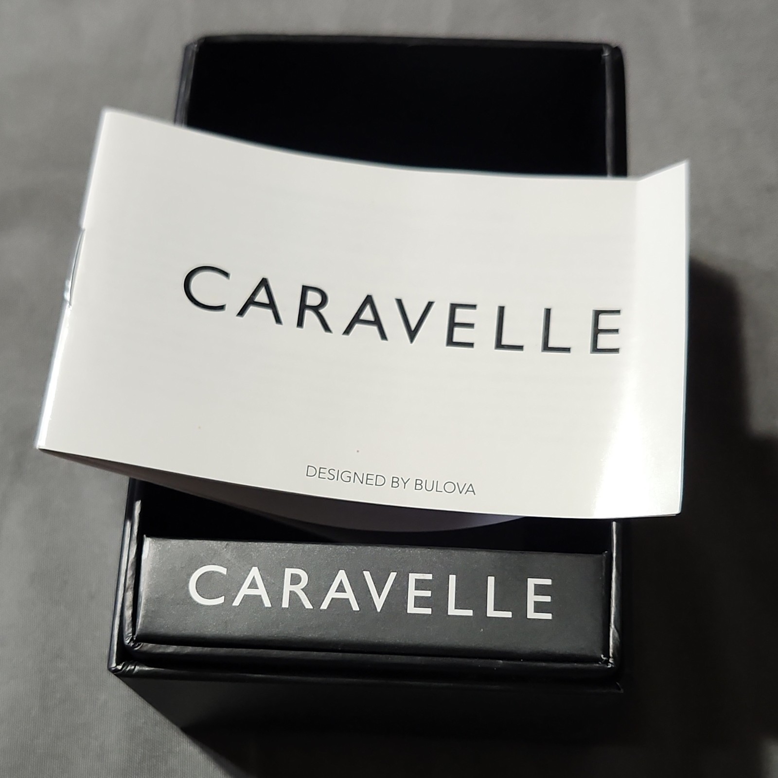 Caravelle New York Men’s Quartz Day/Date 43mm Black SS Watch Gray Dial Box