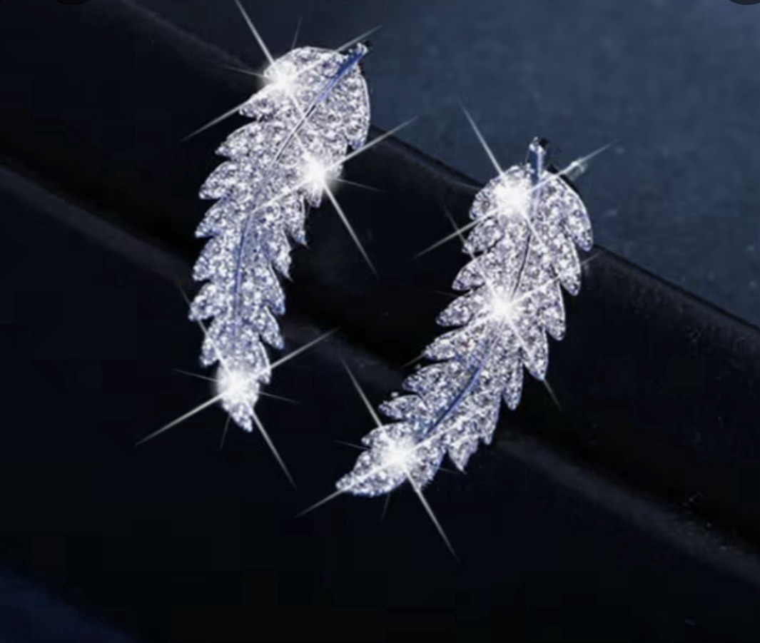 14k white gold plated Feather Earrings # 0057 Box Included.