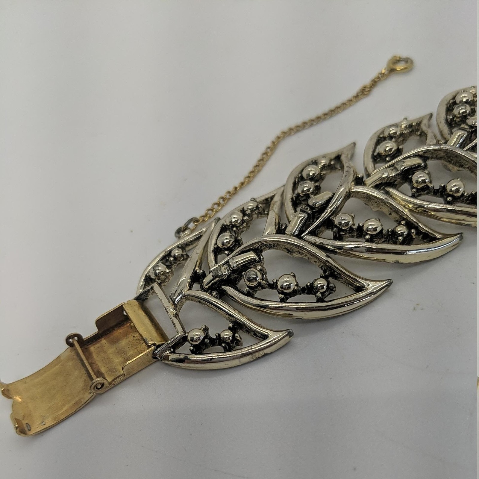 Rousseau Link BRACELET Gold Tone Panels Tail Leaf Fold Over Clasp Safety Chain
