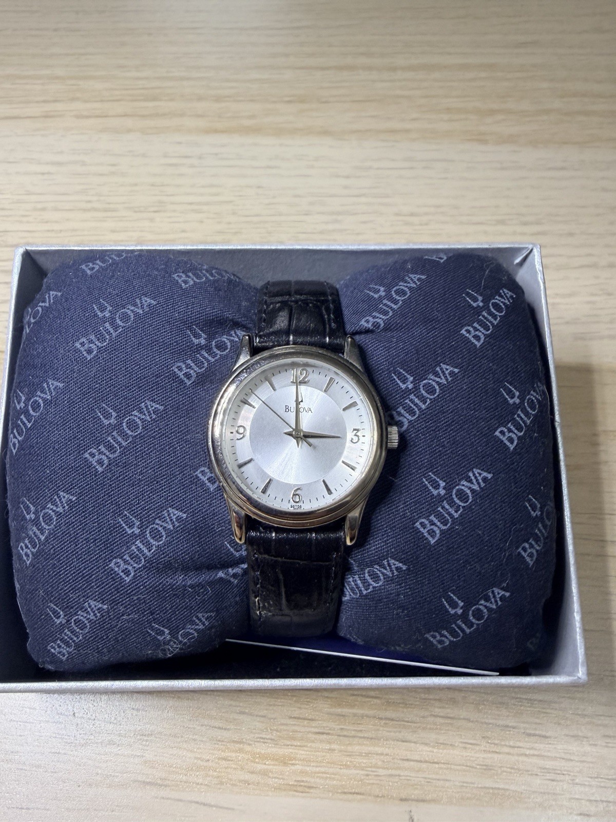 Bulova 96T58 Lady’s Watch 2007 Silver Dial Black Leather Band. Needs Battery