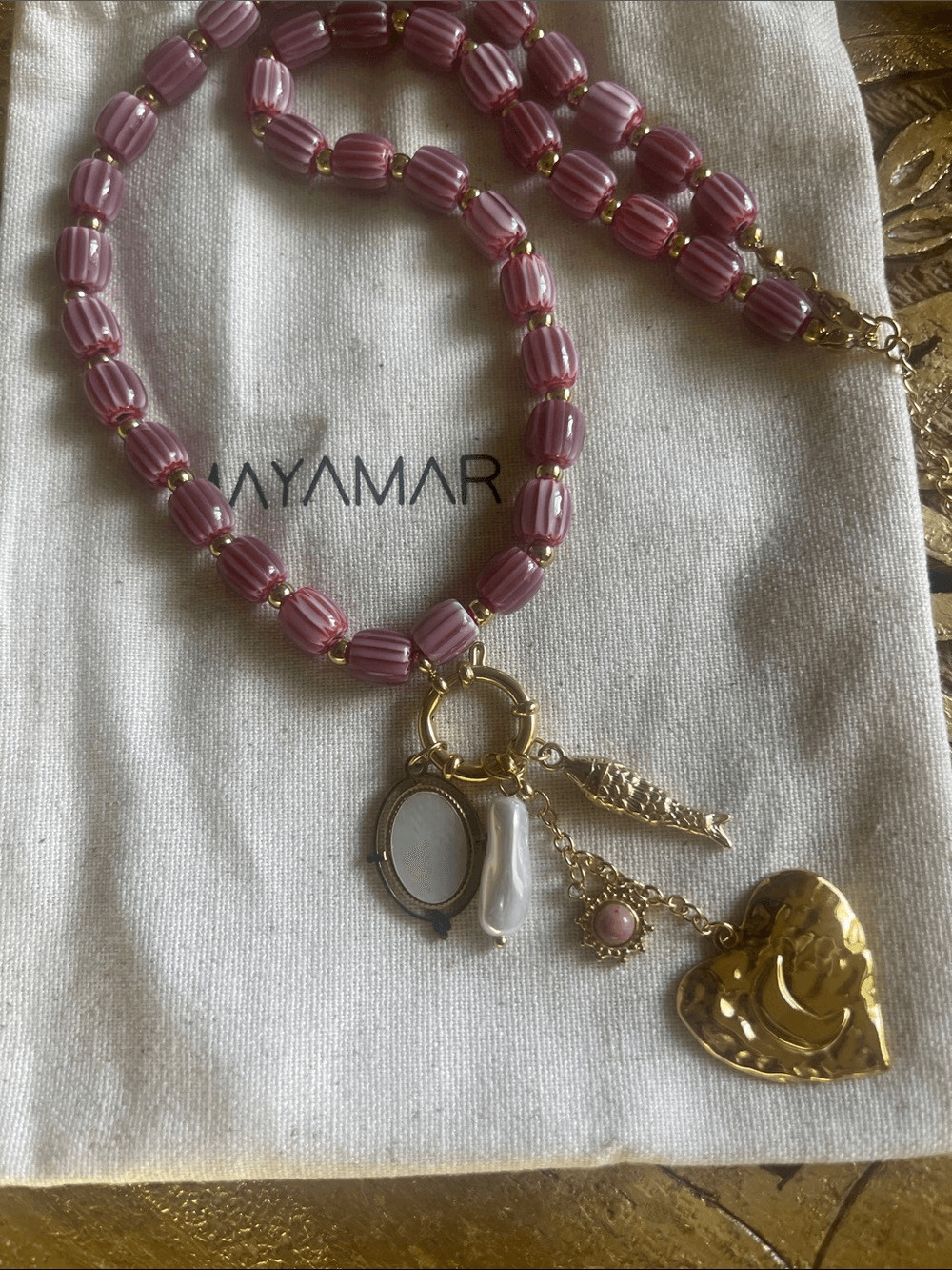 Gold Charm Necklace with Burgundy Ceramic Beads (fish, heart, freshwater pearl)