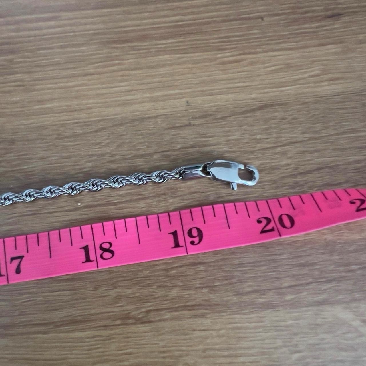Silver “GLD” chains with a cross style pendant. All brand new