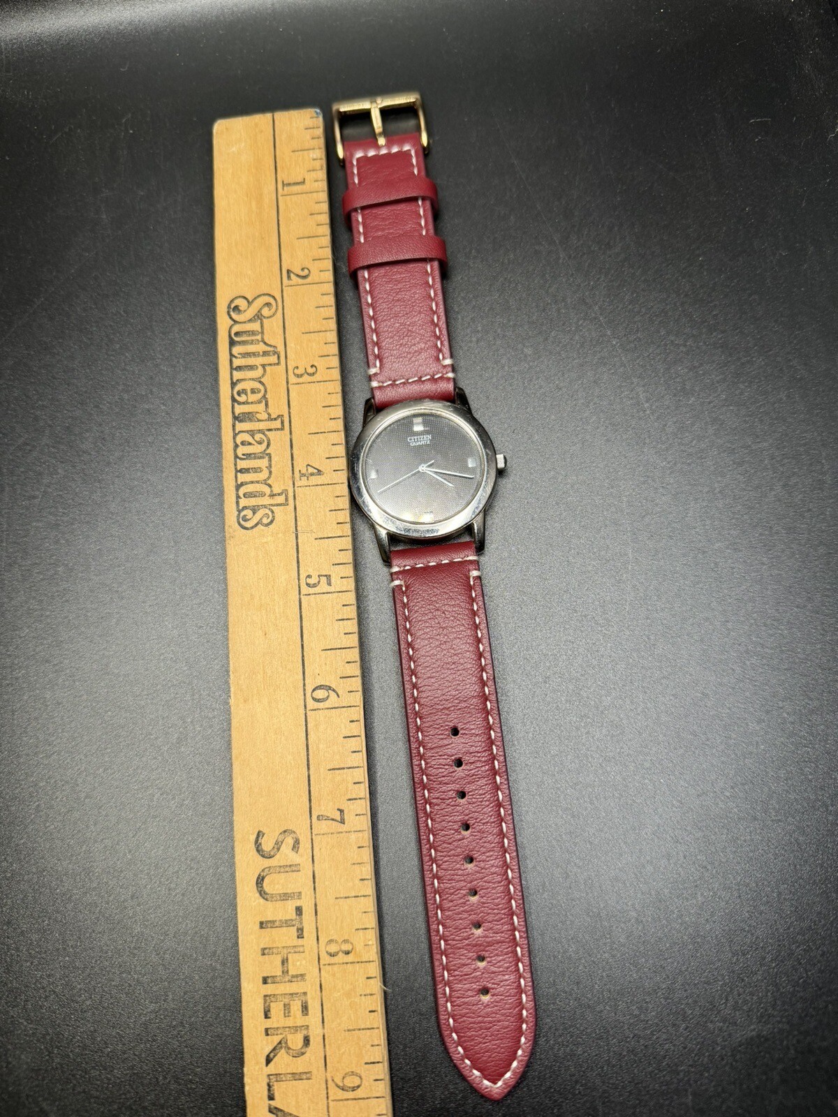 Citizen Quartz Silver Tone Dark Gray Dial Number-Less Watch Burgundy Strap