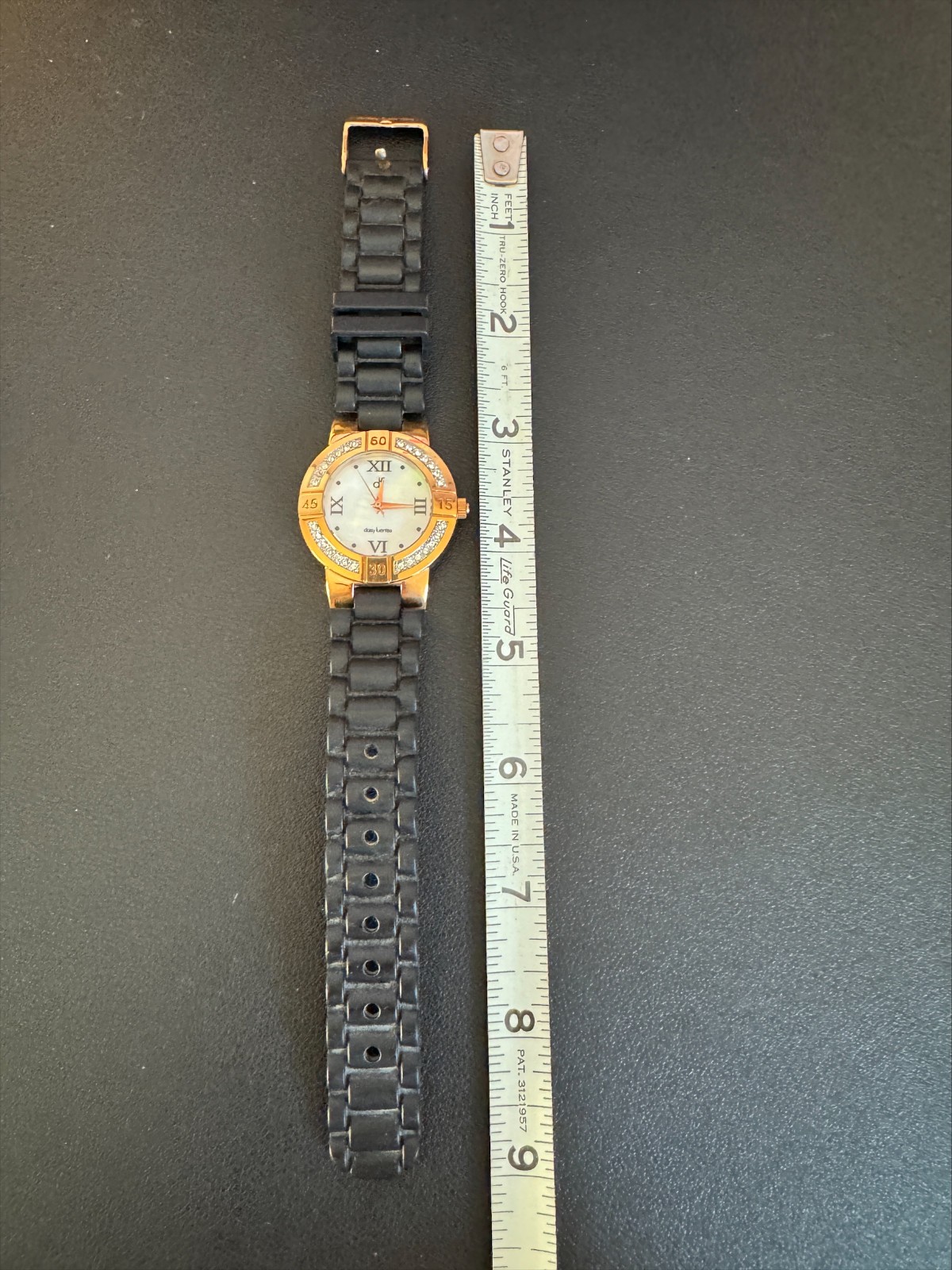 Daisy Fuentes Rhinestone Watch MOP Dial Black Strap Women’s Japan Movement