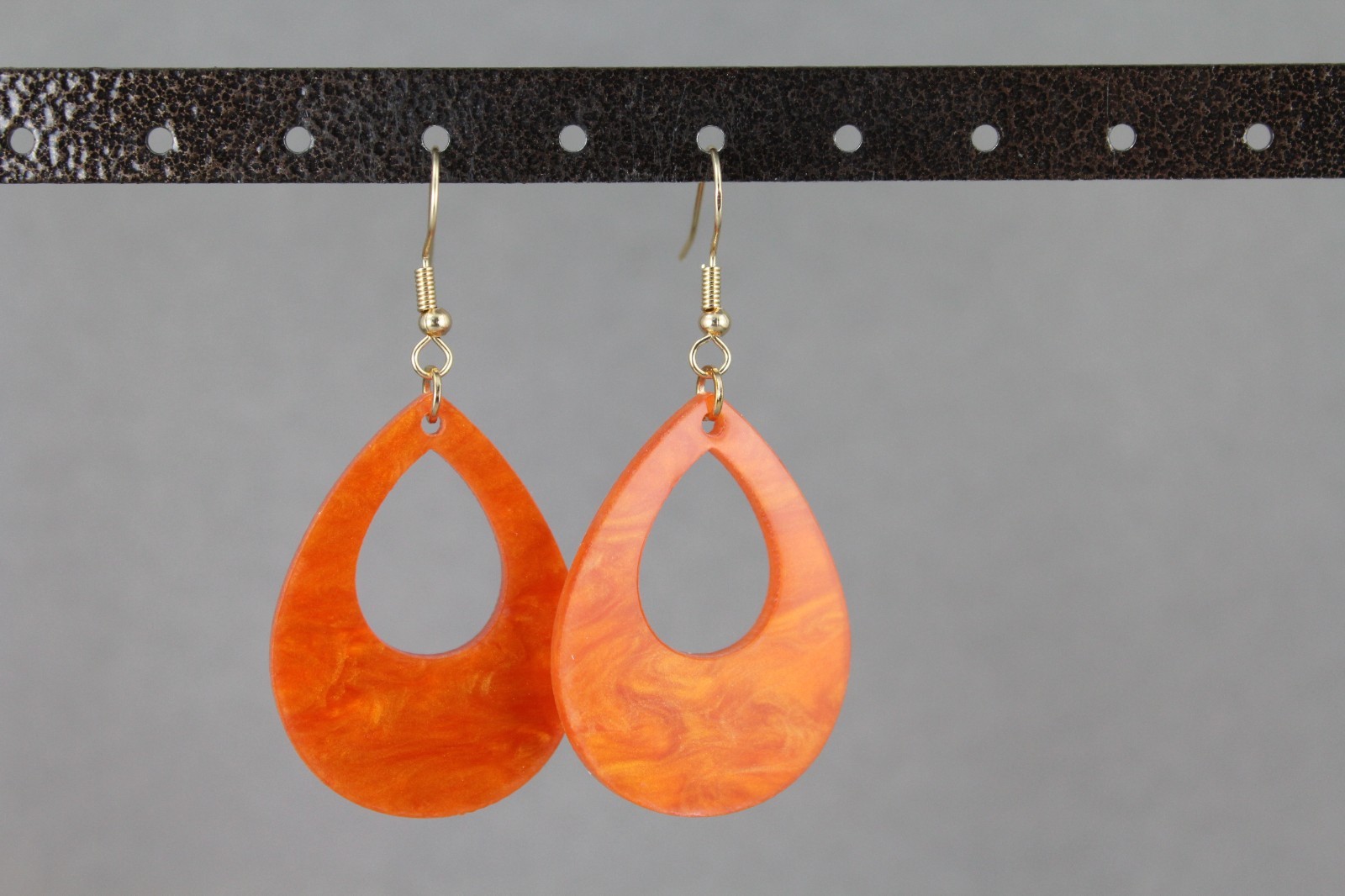 Orange teardrop earrings lightweight dangle cut out oval outline 2.25″ long