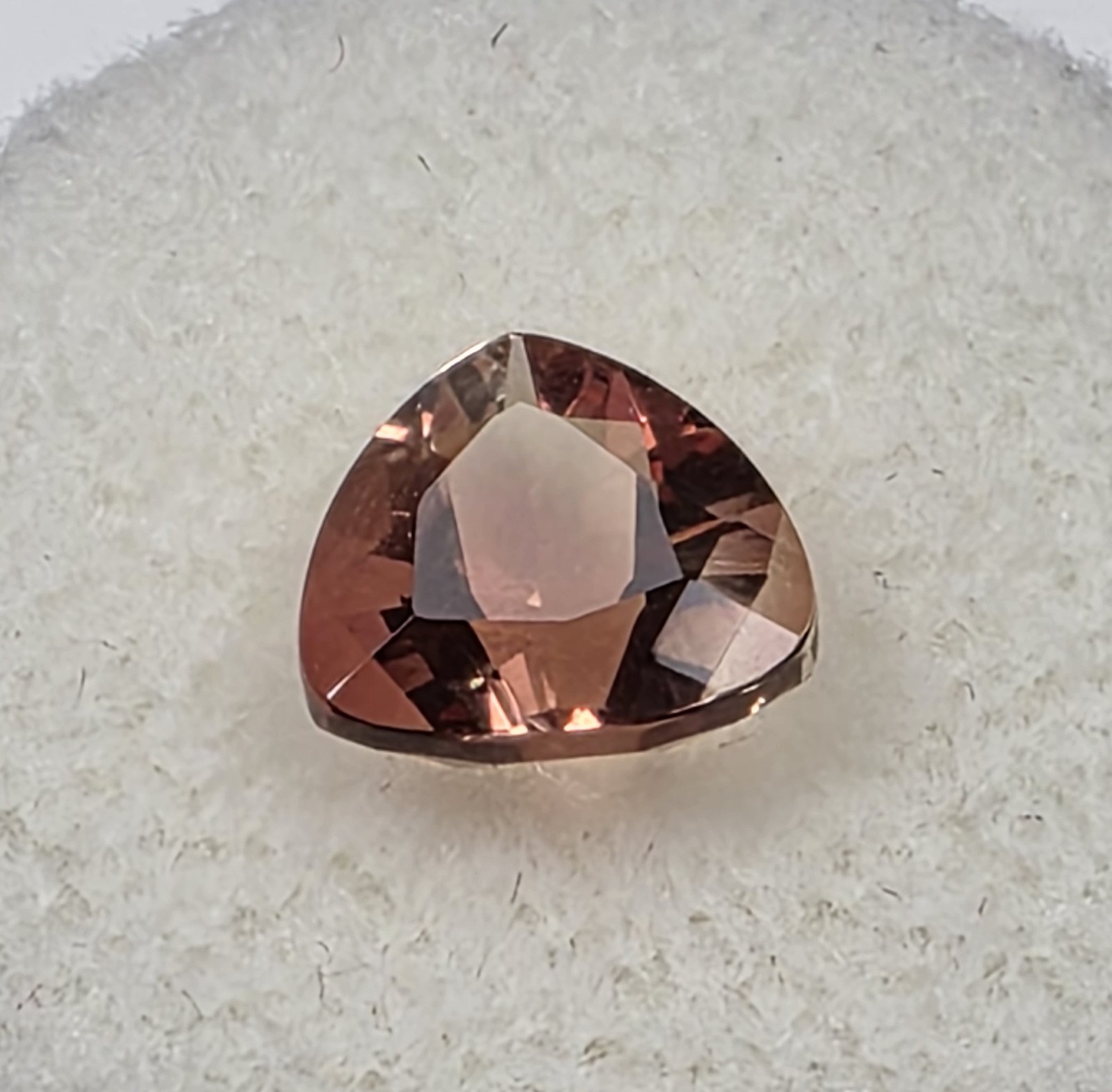 1.72 ct Oregon Sunstone –Trillion Cut – Reddish Orange Color Center Under Table
