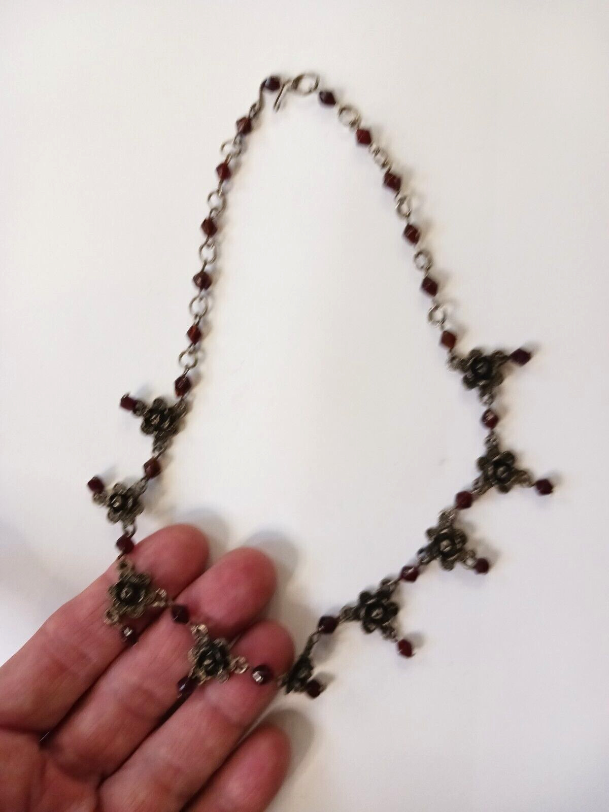 Beautiful silver tone necklace with flowers and red stones. hook clasp. Vintage