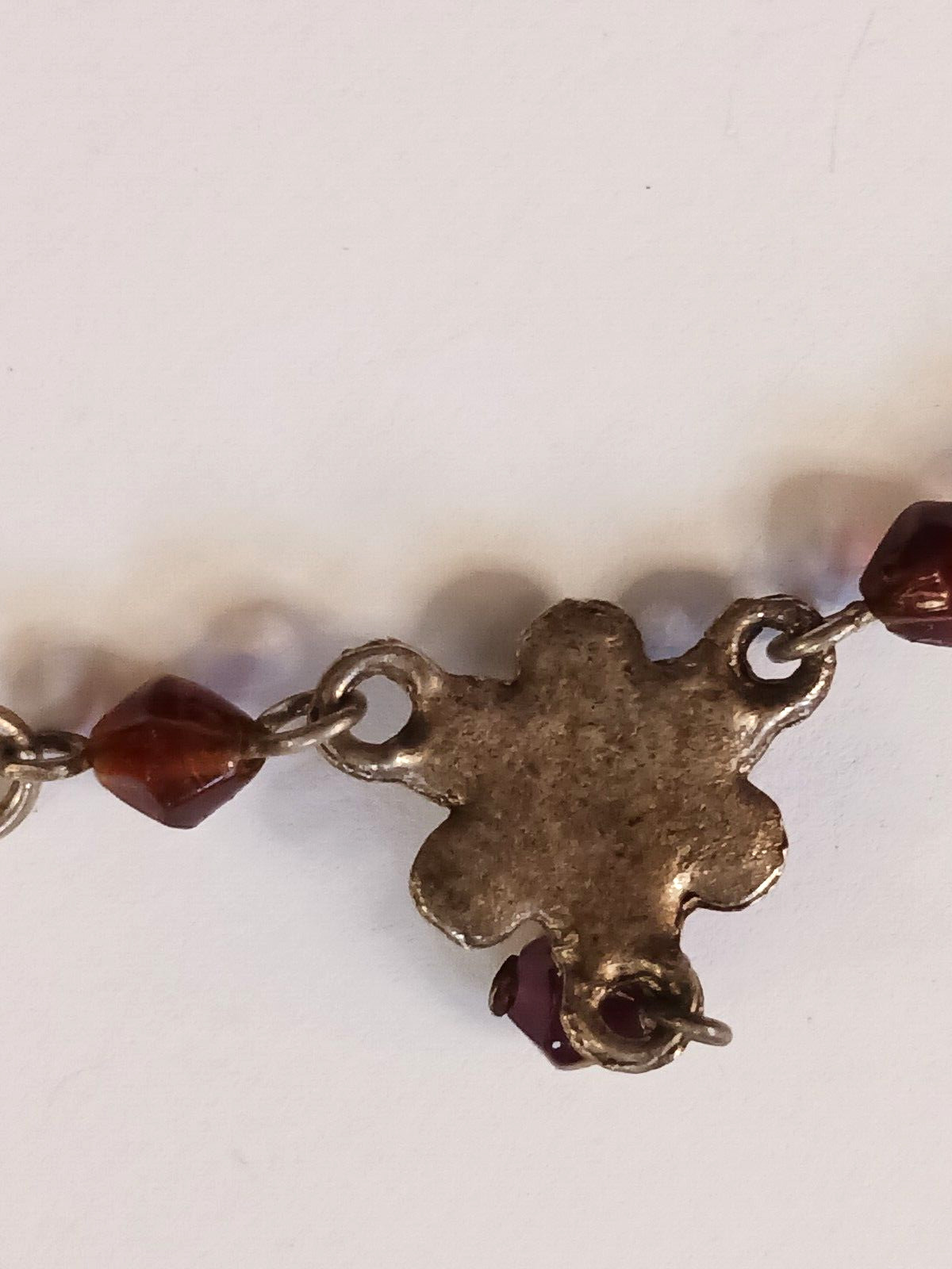 Beautiful silver tone necklace with flowers and red stones. hook clasp. Vintage