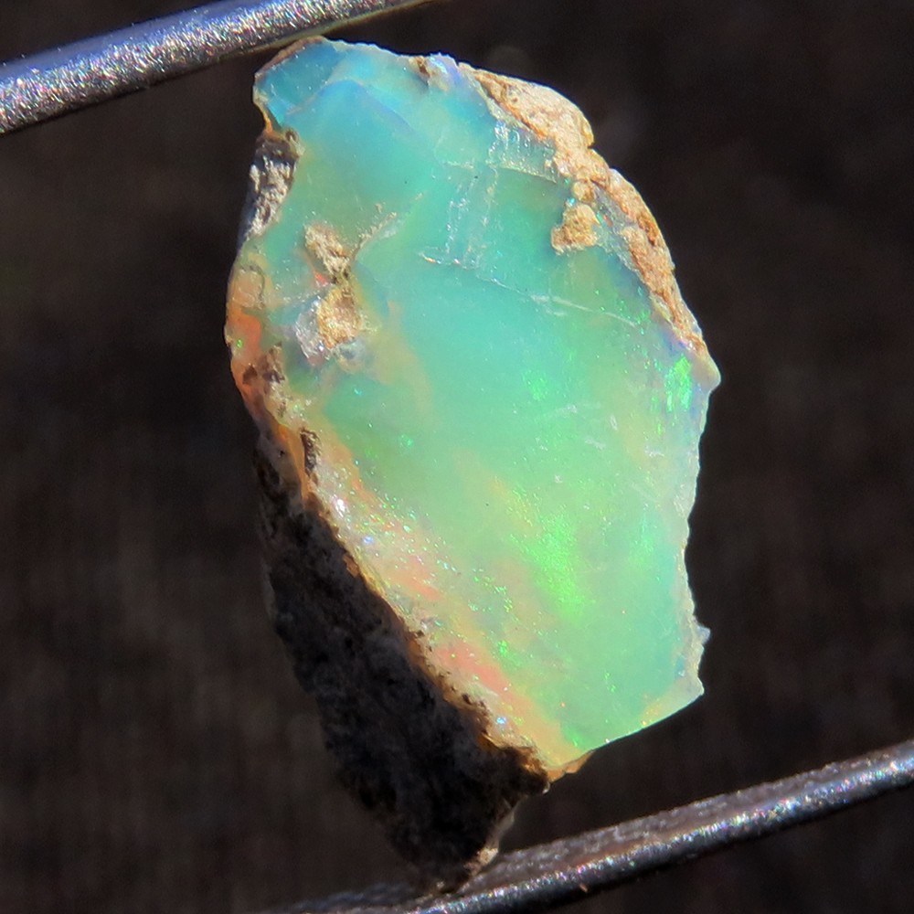 3.45 Carat. Genuine Play of MultiColor Ethiopian Opal Rough Gemstone 08x16x05 mm