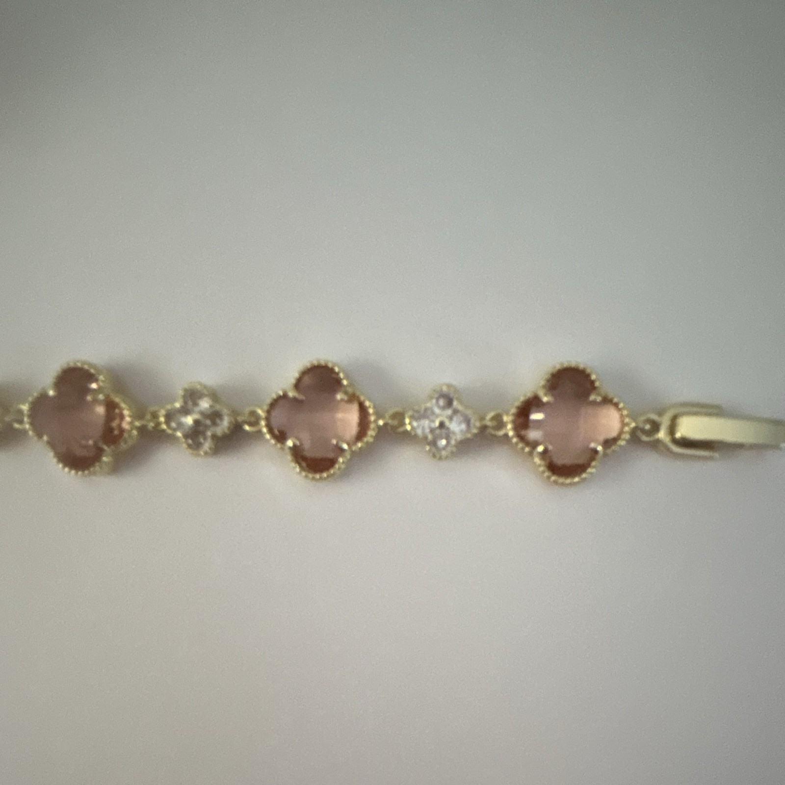 Gold Tone Pink Clover Station Tennis Chain Bracelet with Clear Accents, 7”
