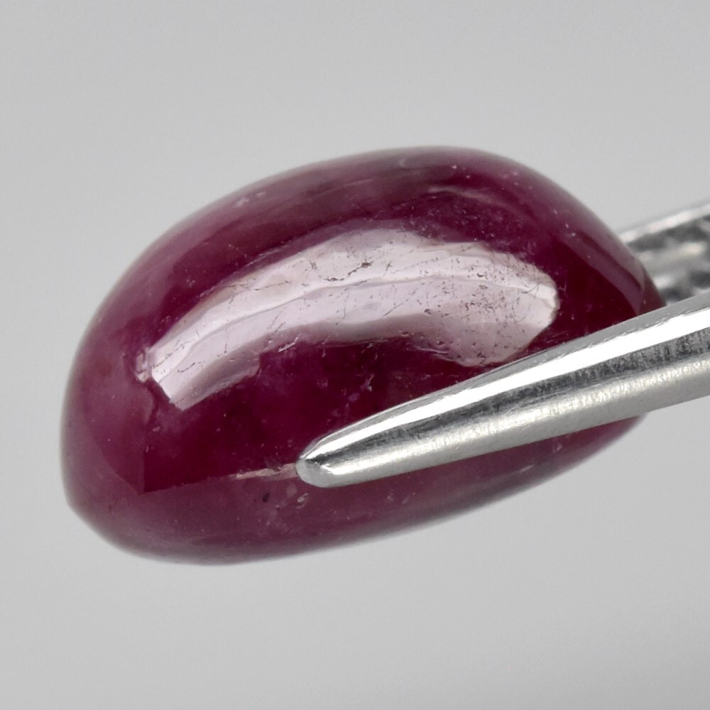 9.05ct 12×9.8mm Oval Cab Purplish Red 6 Ray Star Ruby (Heated Glass Filling)