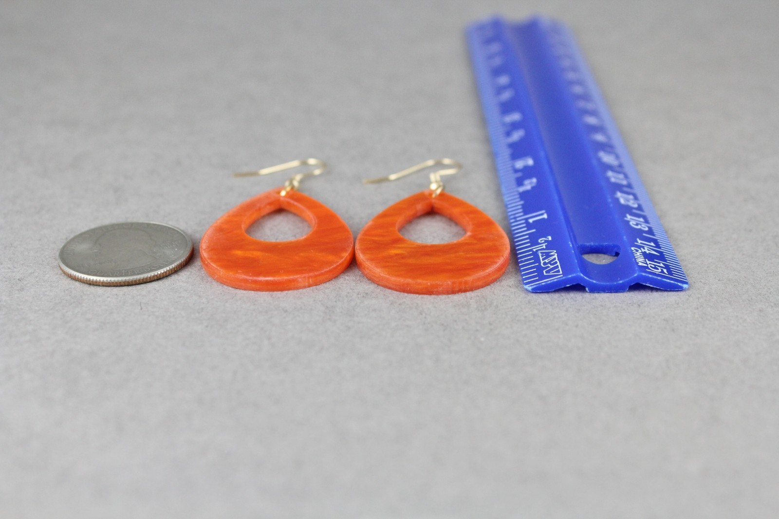 Orange teardrop earrings lightweight dangle cut out oval outline 2.25″ long