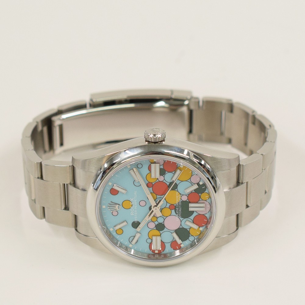 Rolex Oyster Perpetual 41 124300 Celebration Dial Steel Box & Papers Mint