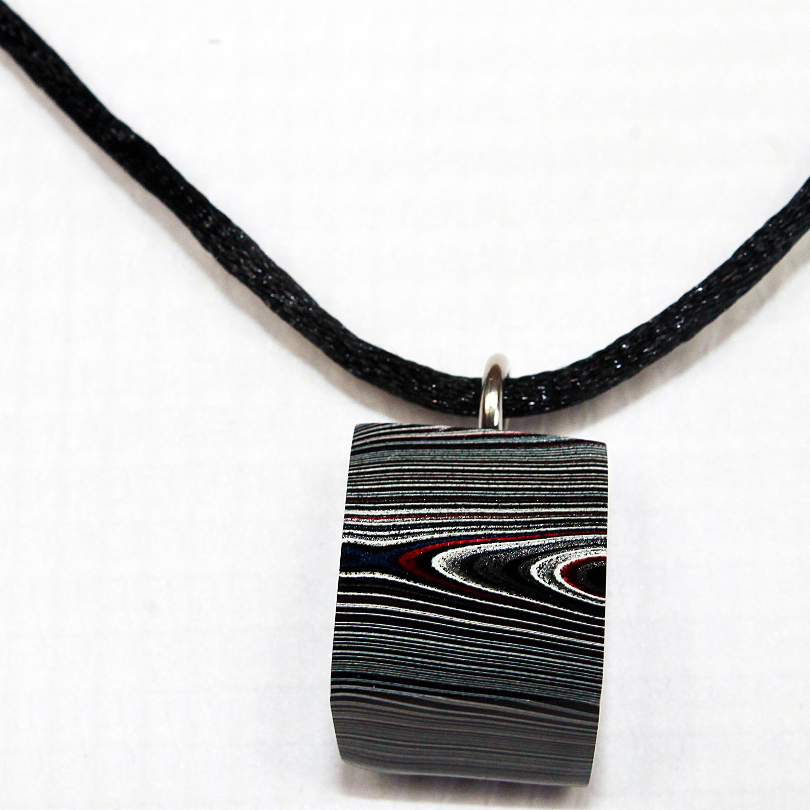 Fordite Necklace – 18.35mm x 15.2mm x 12.83mm – Black Leather Rope (N-019)